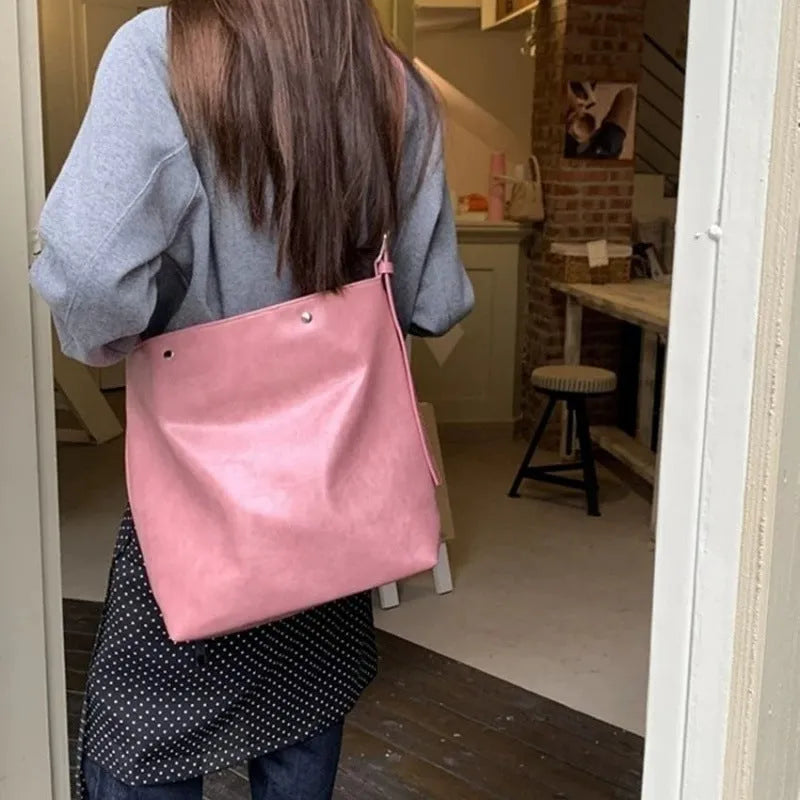 Corduroy one-shoulder commuter bag in pink or brown with PU lining, showing 39cm length dimensions