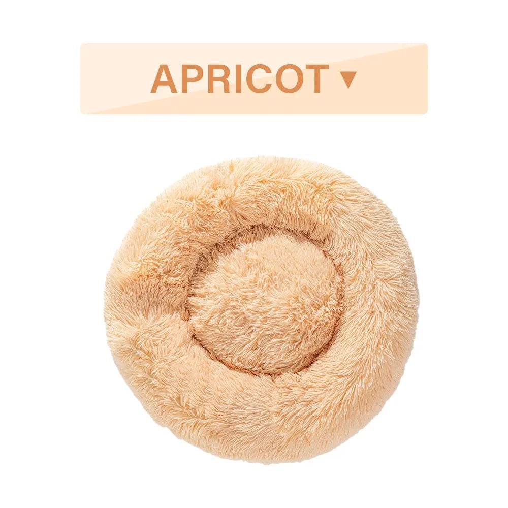 Fluffy donut-shaped dog bed with raised edges in luxury long plush fabric