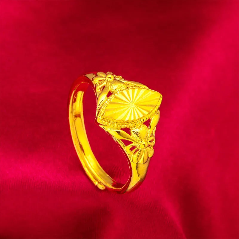 Open geometric flower ring in gold colour with textured details on brass base