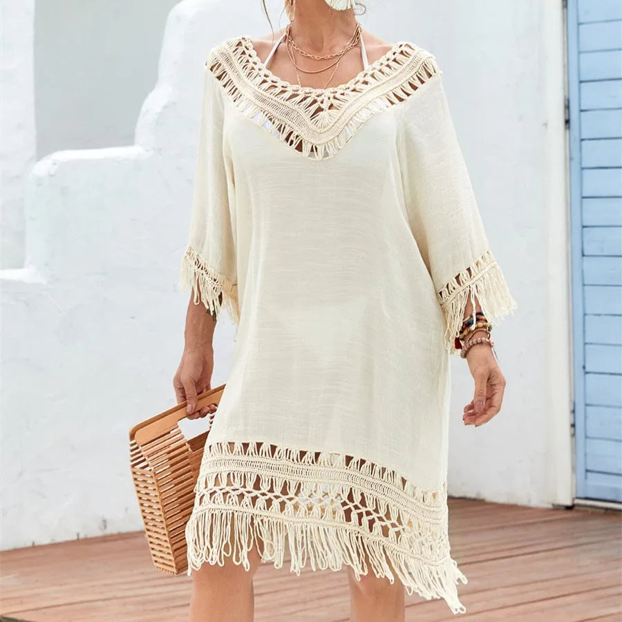Apricot crocheted patchwork beach dress with mid-length skirt and half sleeves on hanger