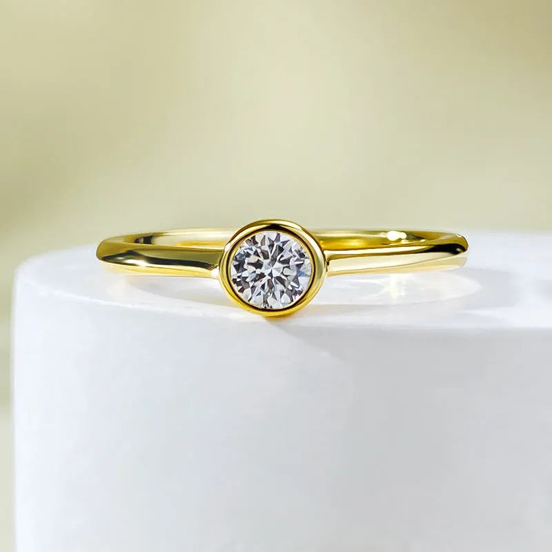 Minimalist crown-shaped silver ring with line detailing on a white background.