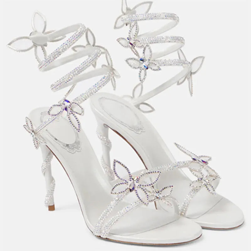Snake butterfly rhinestone flower stiletto heel Roman sandals in gold with buckle closure and super high heel