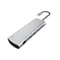 Grey USB-C docking station with aluminium alloy shell showing HDMI, VGA and USB ports