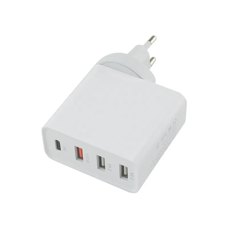 Black four-port USB-C wall charger with UK, EU, US, and AU plug adapters