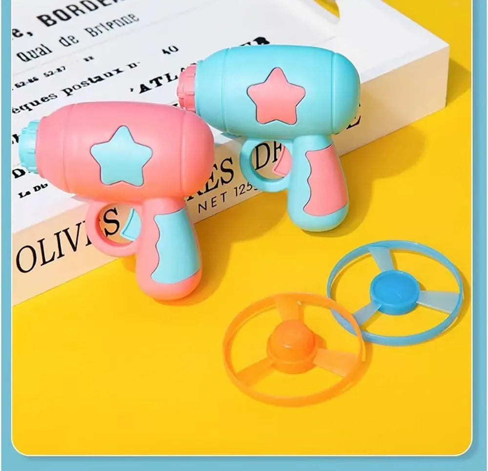 Blue or pink plastic cat toy gun launcher with two coloured frisbees for indoor play.
