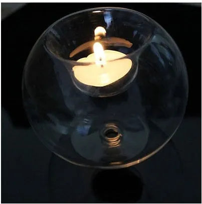 Round clear hollow glass candle holder for hot glass craft on a table