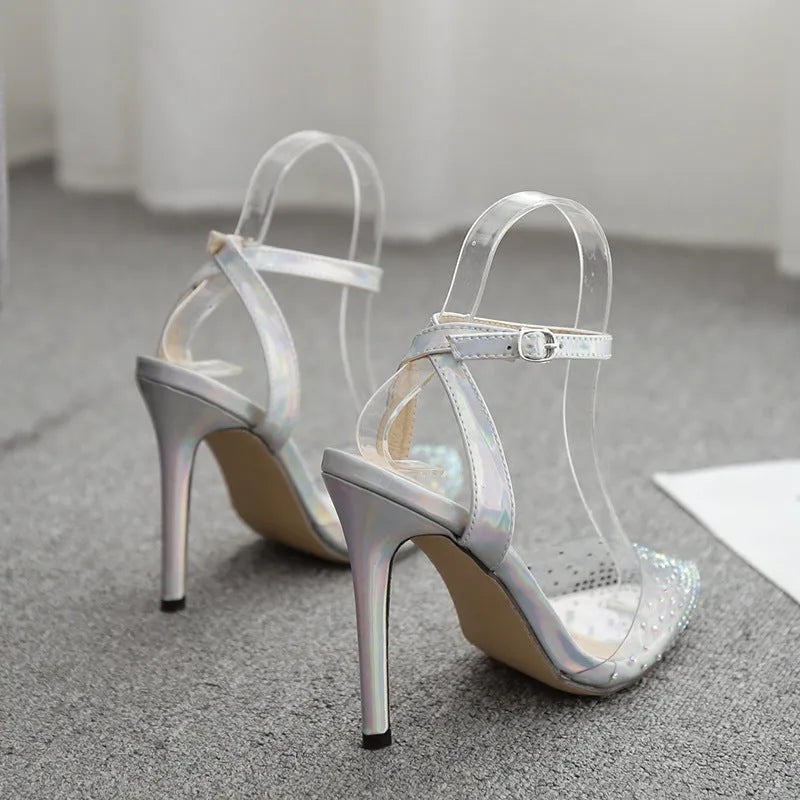 Women's pointed toe stiletto heel sandals with diamond decoration on the PVC upper.