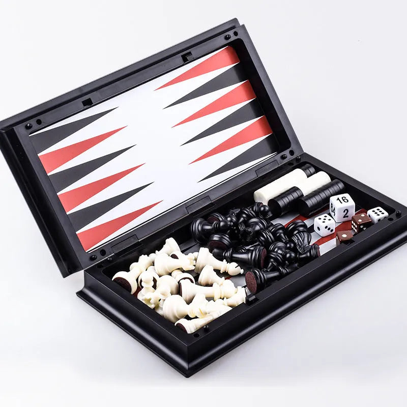 Three-in-one magnetic chess checkers backgammon board game with plastic board and ABS pieces on a table