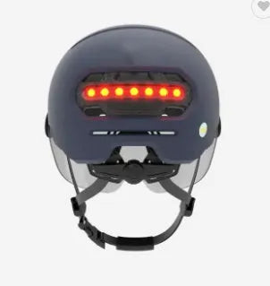 Blue adult cycling helmet with integrated LED front light and red tail light on the back
