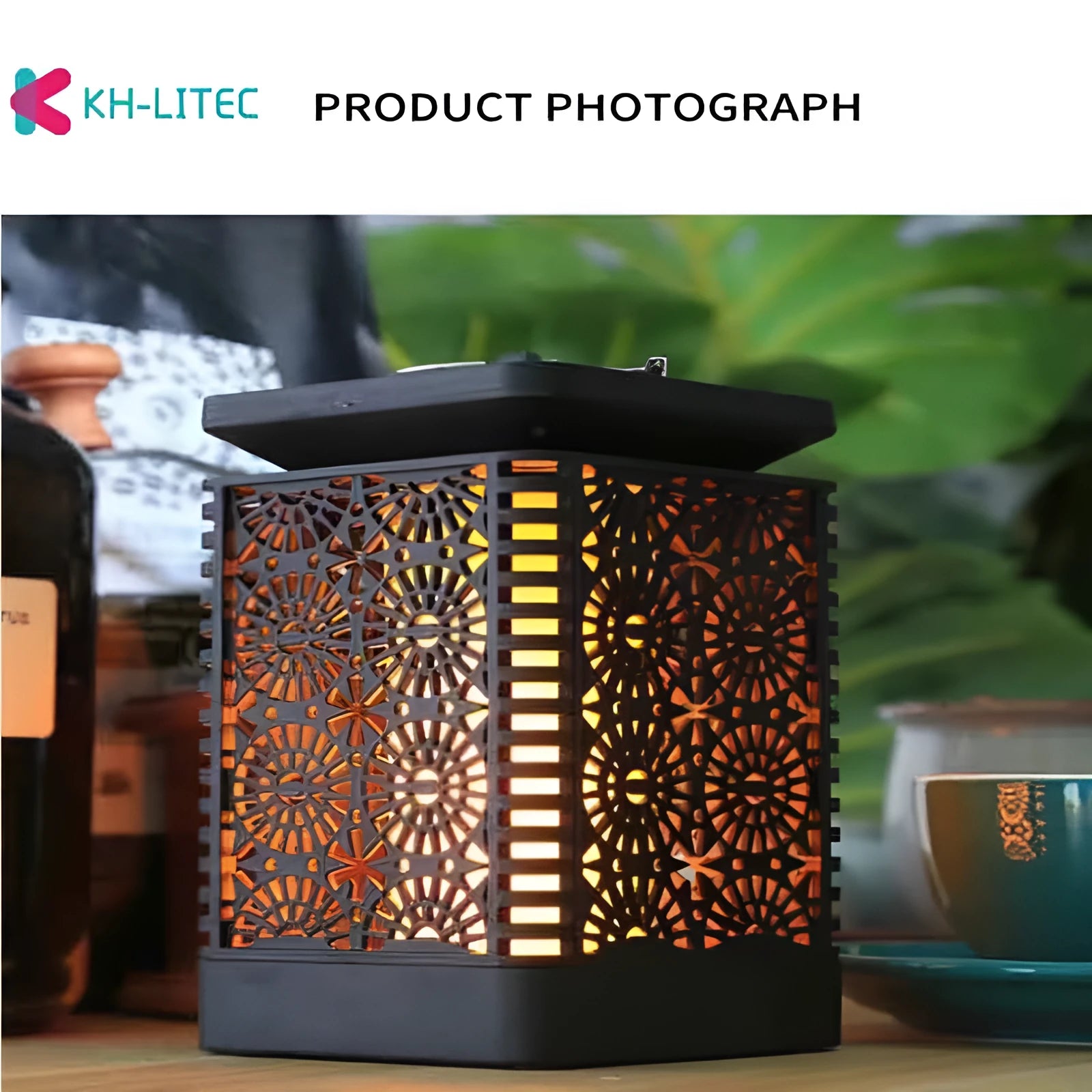 Set of four black solar-powered garden lanterns with flickering flame LED effect