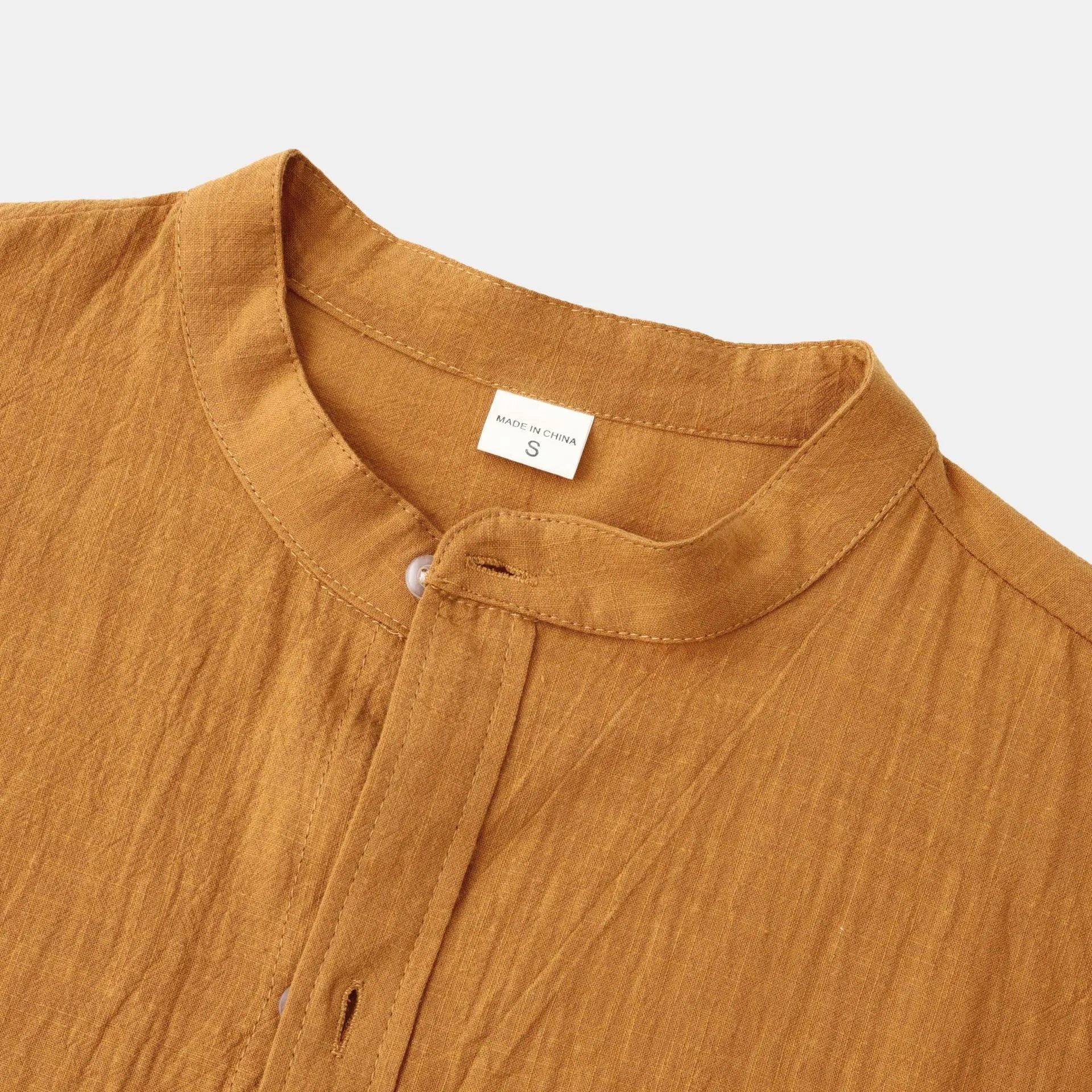 Men's slim solid brown long sleeve shirt and matching casual pants set on display