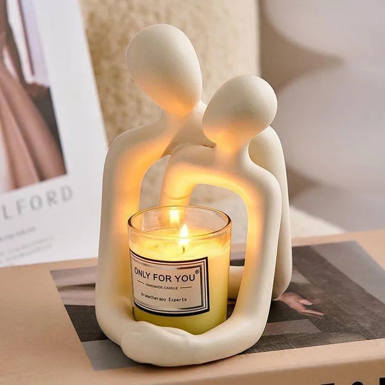 Modern resin sculpture of an embracing couple, available in milky white or gold, for shelf or desk decor.