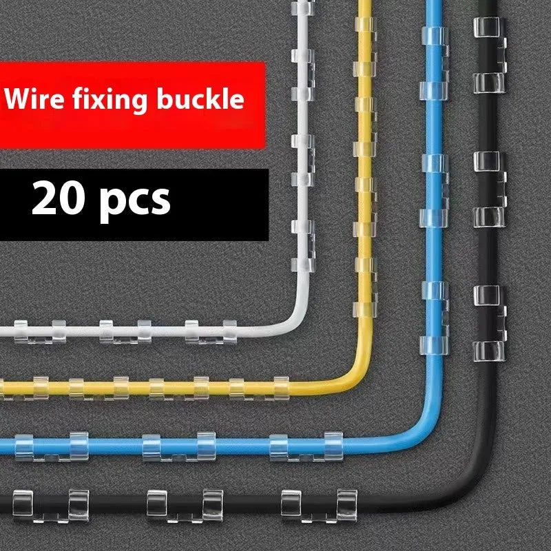 Transparent plastic self-adhesive wire holder routing snap clip on a desk surface with a white cable inserted