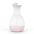 White ultrasonic humidifier diffuser with colourful LED night lights and mist output
