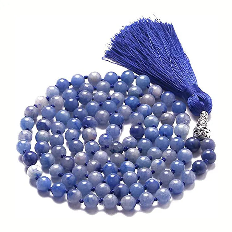 Long beaded agate and amethyst tassel necklace with blue grain stone and lapis lazuli on a geometric design.