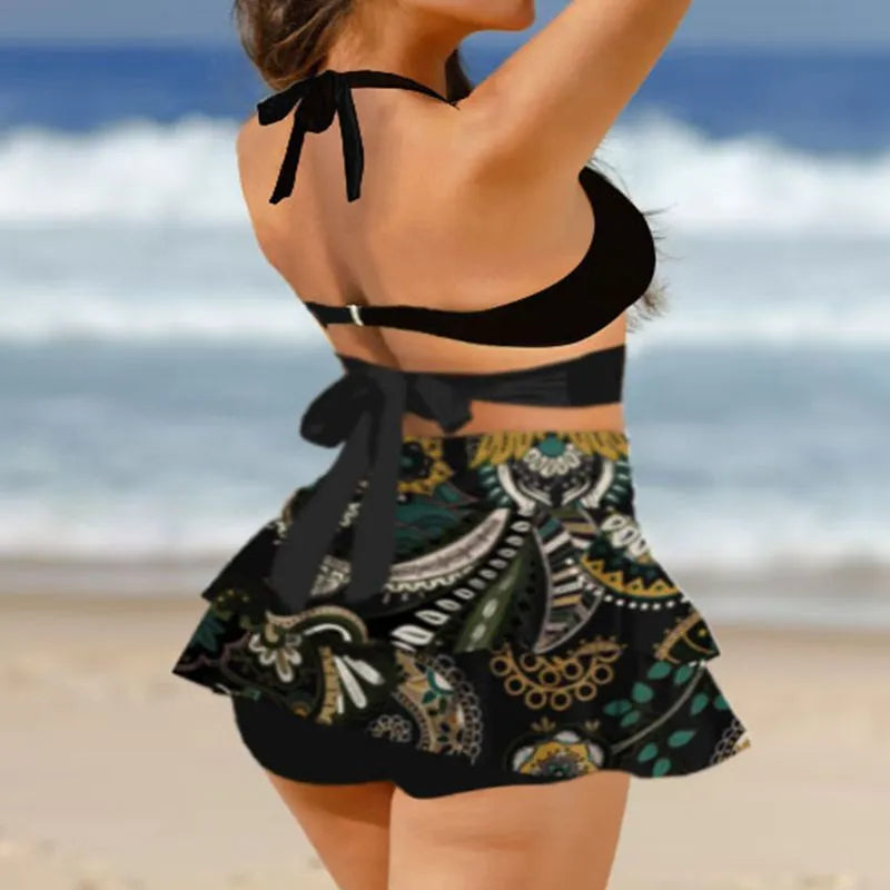 Purple women's bikini set showing lace-up backless top and high-waist briefs with a split skirt.