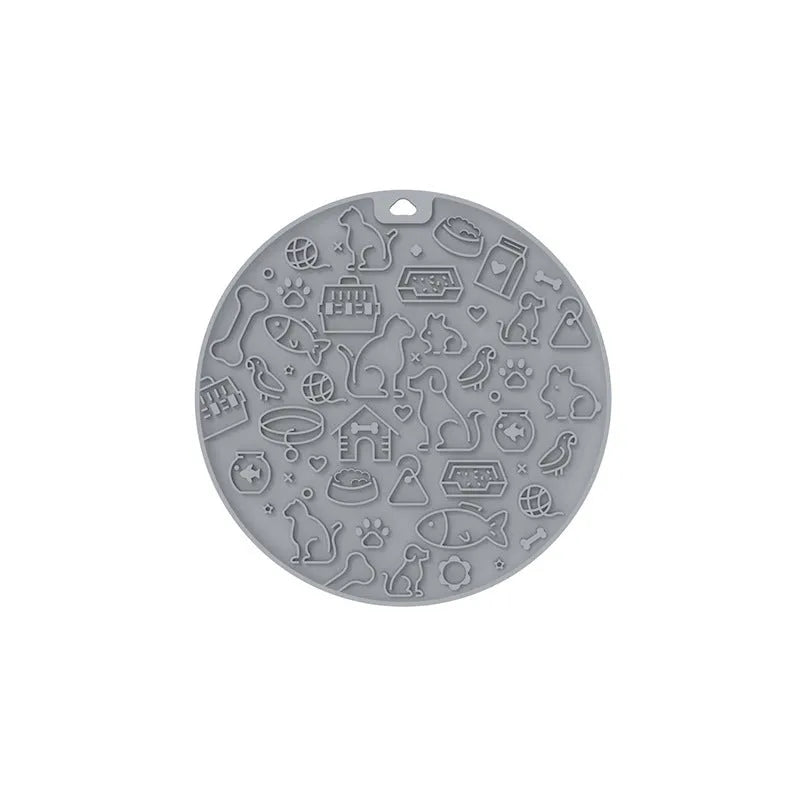 Round silicone pet licking mat with textured grooves and a sucker base, shown in blue colour.