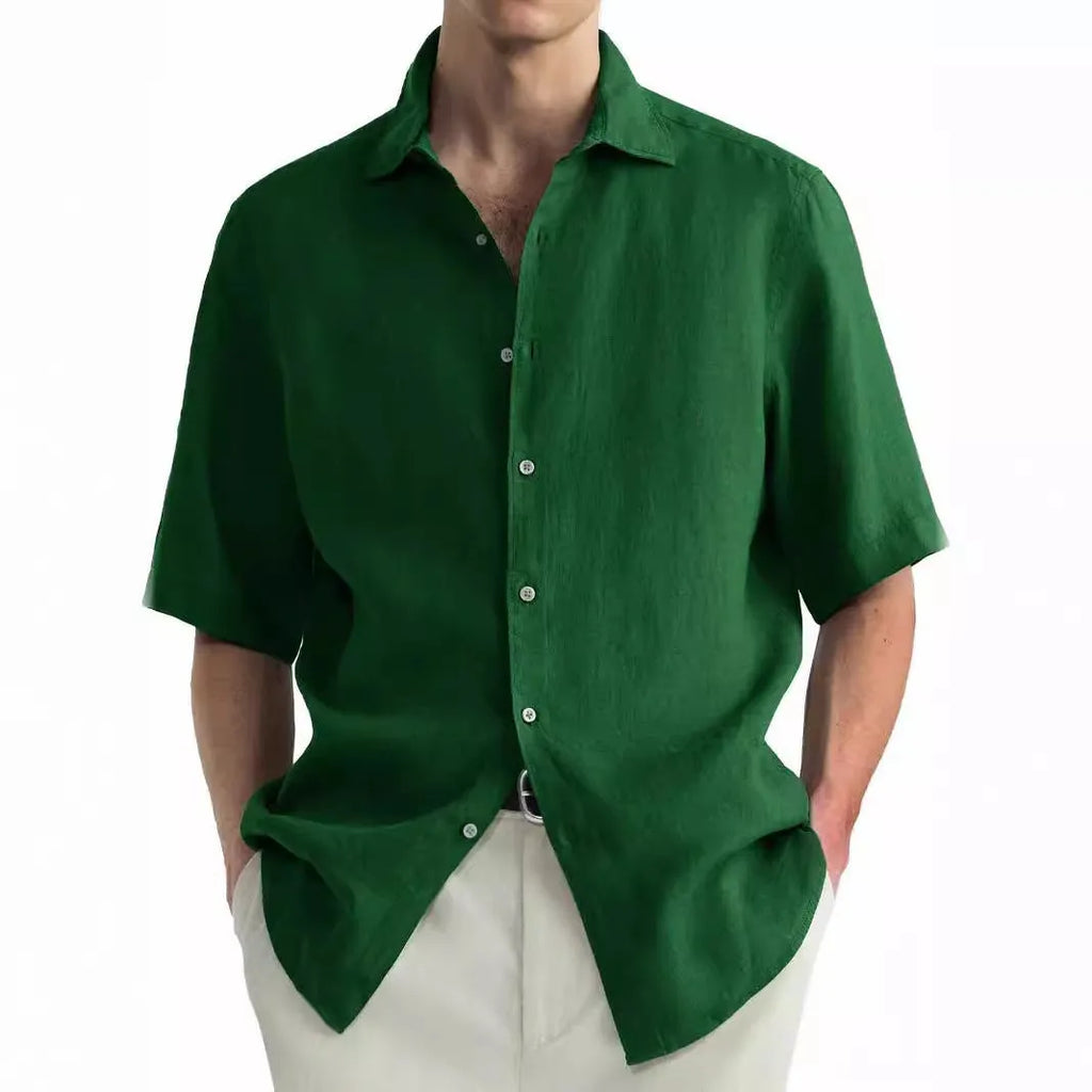 Man wearing a green washed cotton casual button-down shirt in a regular fit.