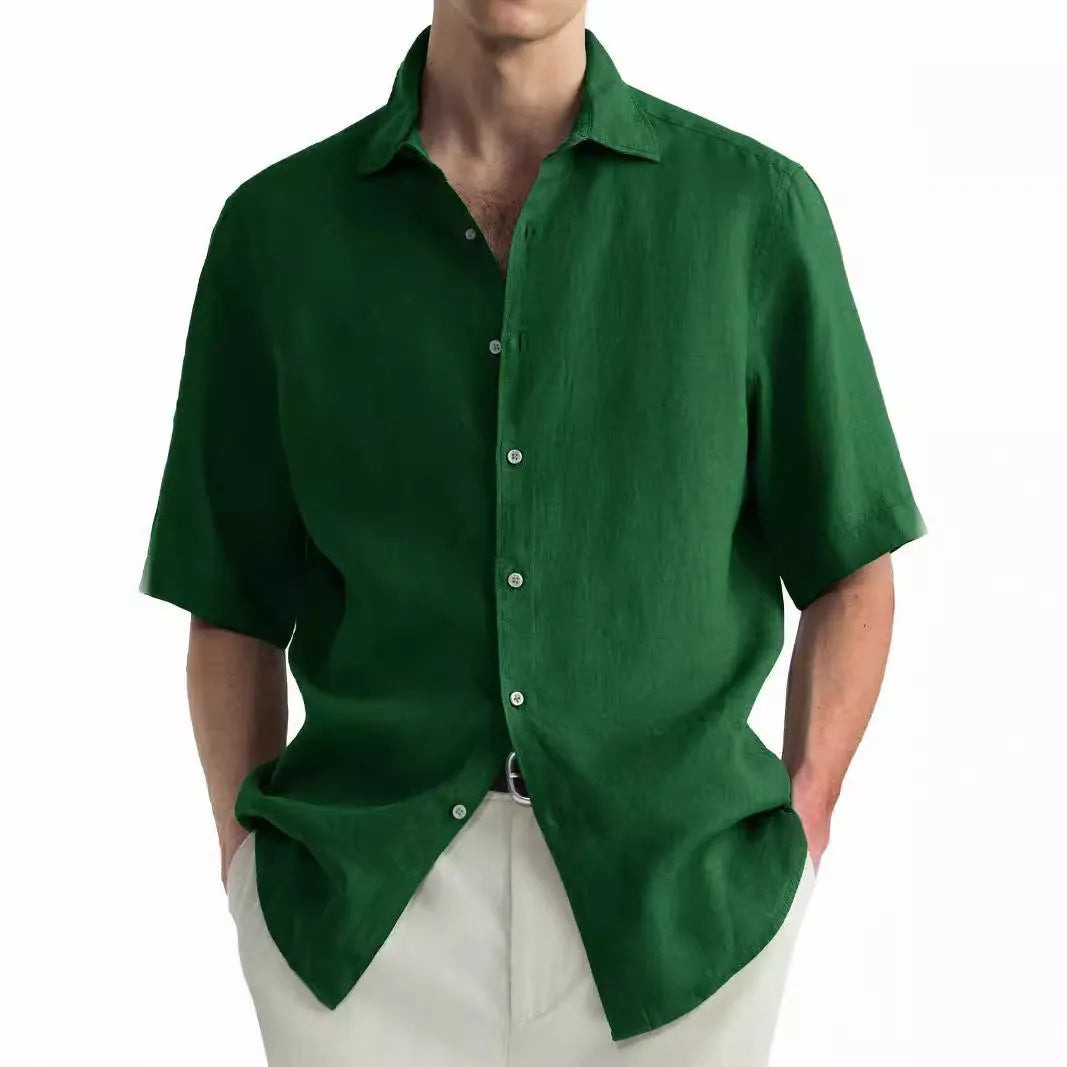 Man wearing a green washed cotton casual button-down shirt in a regular fit.
