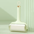 Sticky hair roller with high-viscosity adhesive paper, tear-type replacement sheets, in green colour on fabric