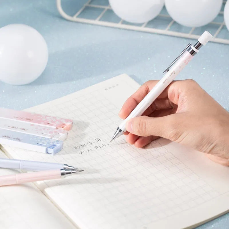 Set of three cartoon-style 0.5mm automatic pencils and boxes of HB lead refills.