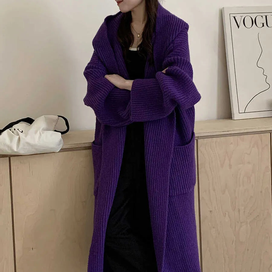 Loose hooded acrylic cardigan coat with extended length and raglan sleeves