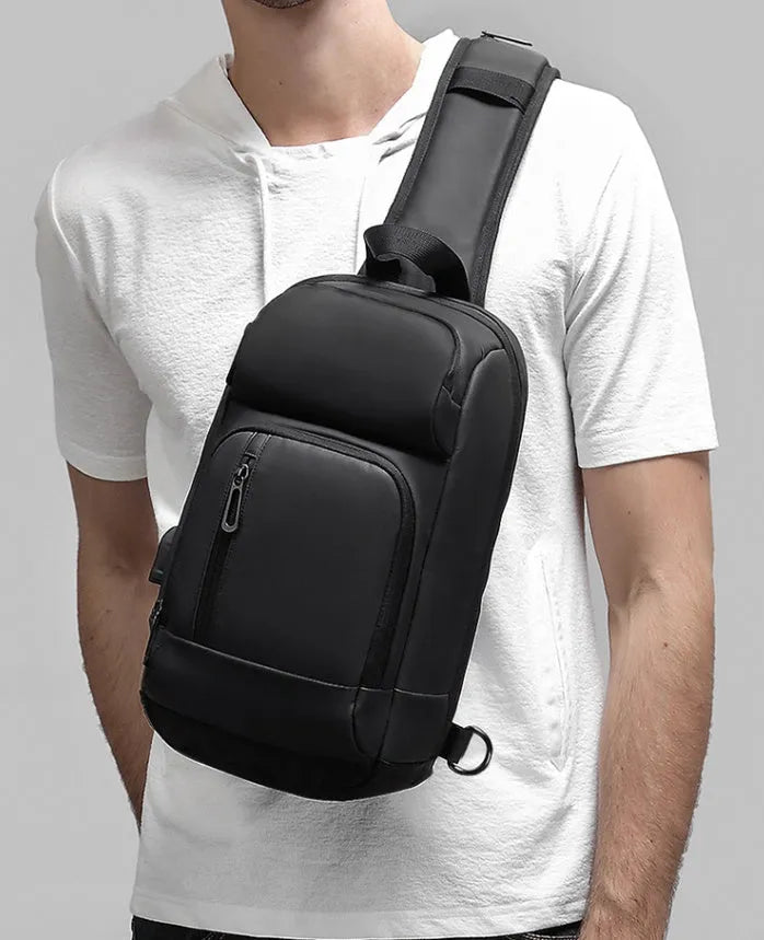 Black medium capacity outdoor shoulder bag with air cushion strap and multiple compartments