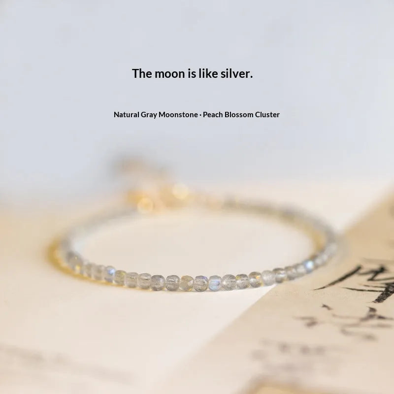 Natural gray moonstone diamond-shaped beads on a silver bracelet with clasp