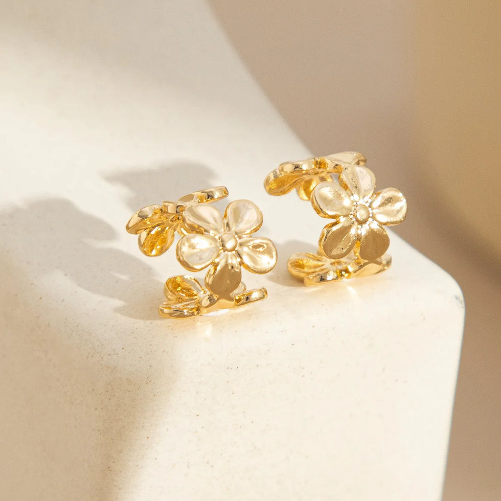 Gold starfish and conch shell drop earrings for women with animal zodiac design