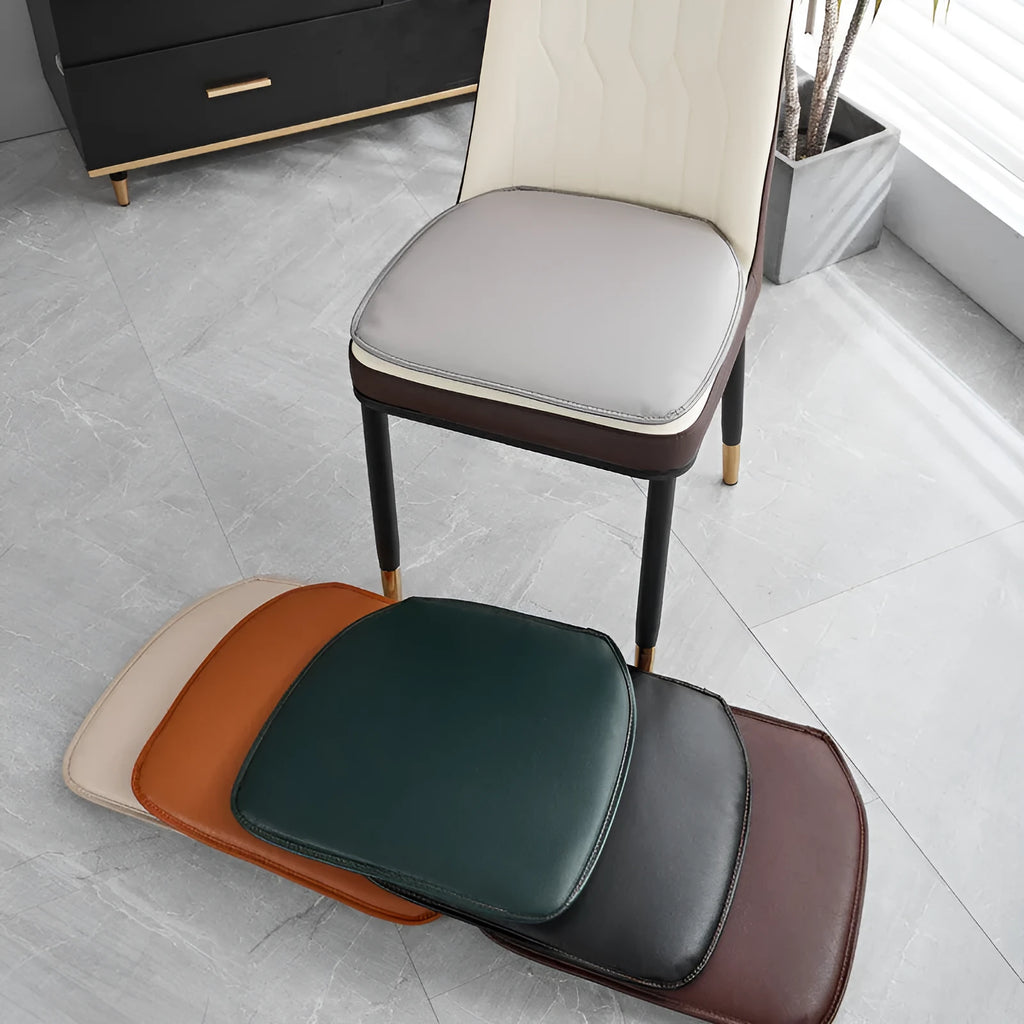 Solid-colour leather horseshoe-shaped seat cushion showing non-slip base.