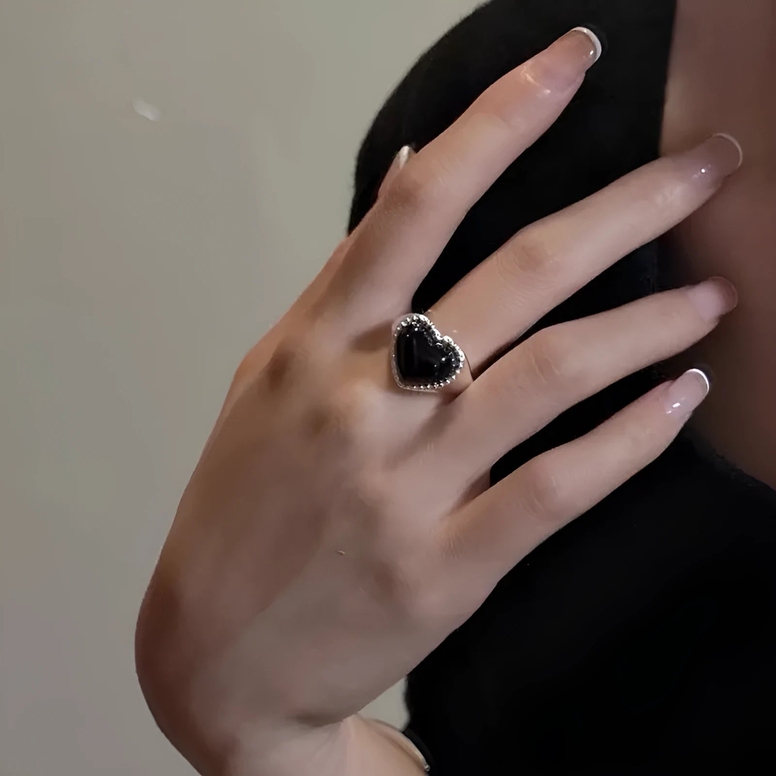 S925 sterling silver adjustable ring with black agate heart stone on finger