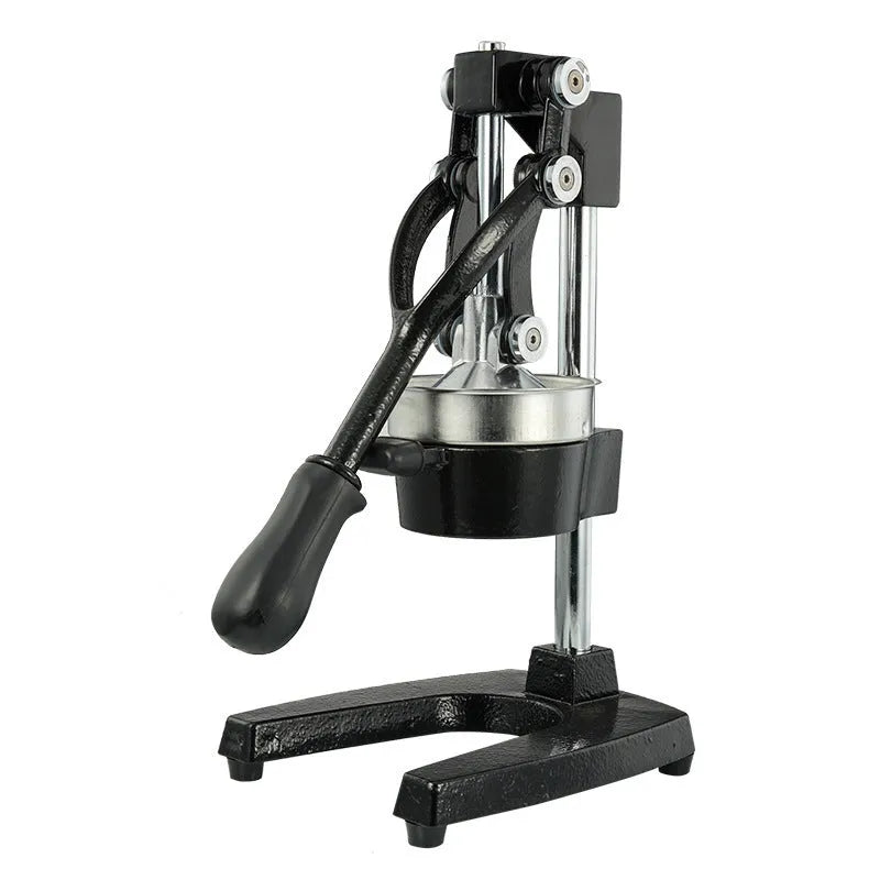 Tall black manual citrus juicer with cast iron base and stainless steel cone on a kitchen counter.