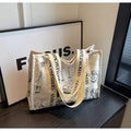 Large canvas shoulder tote bag with printed design, shown in available colour and pattern options.