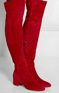 Grey suede women's over-the-knee flat boots with a pointed toe and thick low rubber sole.