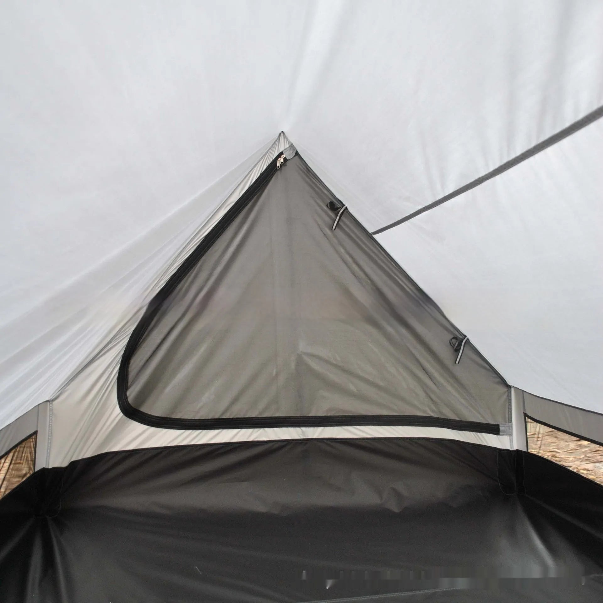 Brown A-line trekking tent pitched using hiking poles with dimensions 210x150x110cm