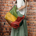 Cowhide leather crossbody shoulder travel bag showing 48cm dimensions with laptop compartment