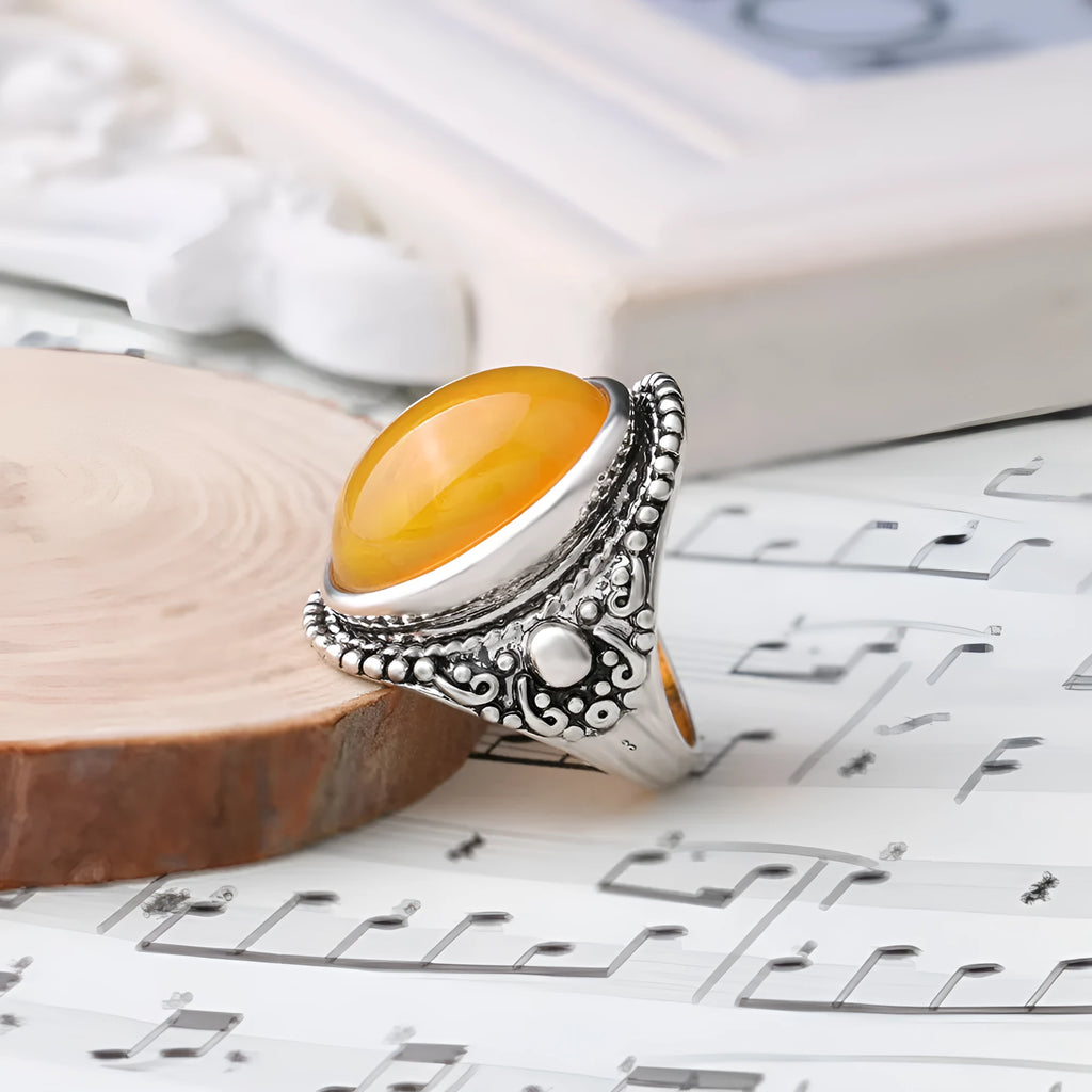 Retro geometric alloy ring with antique silver amber electroplating showing fluorescent beeswax elements