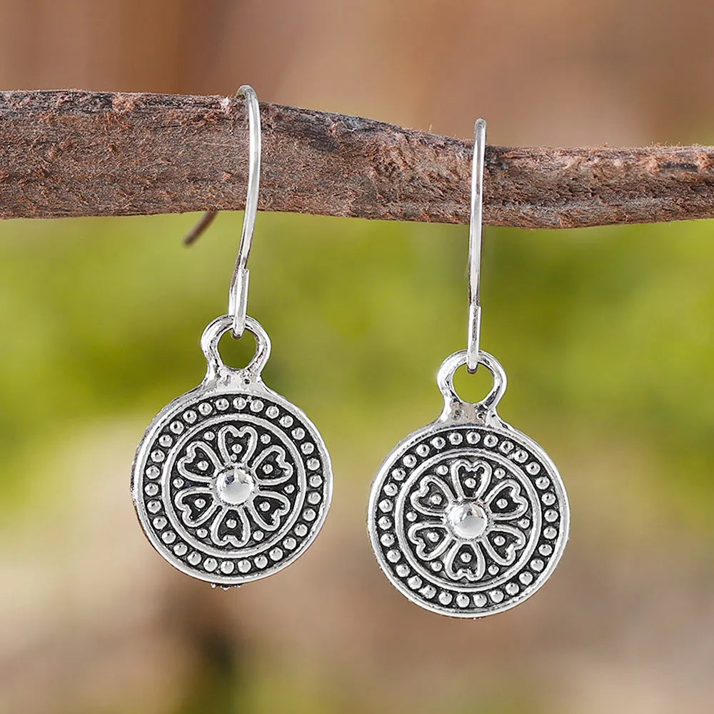 Bohemian style geometric round earrings with distressed ethnic print and retro electroplated finish
