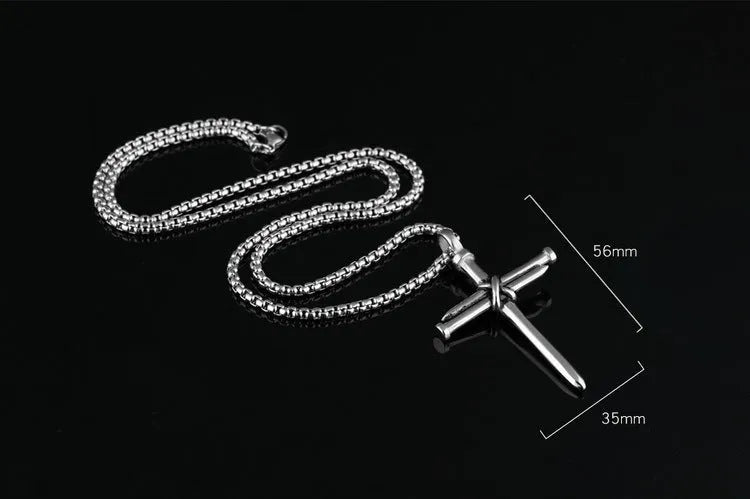 Titanium steel cross nail pendant necklace for men in silver finish on display