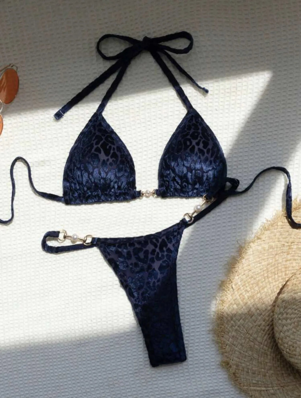 Blue leopard print women's T-shaped swimsuit bikini with spandex on a mannequin.