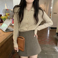 A loose-fitting, long-sleeved beige knitted cardigan for women, made from viscose fibre.