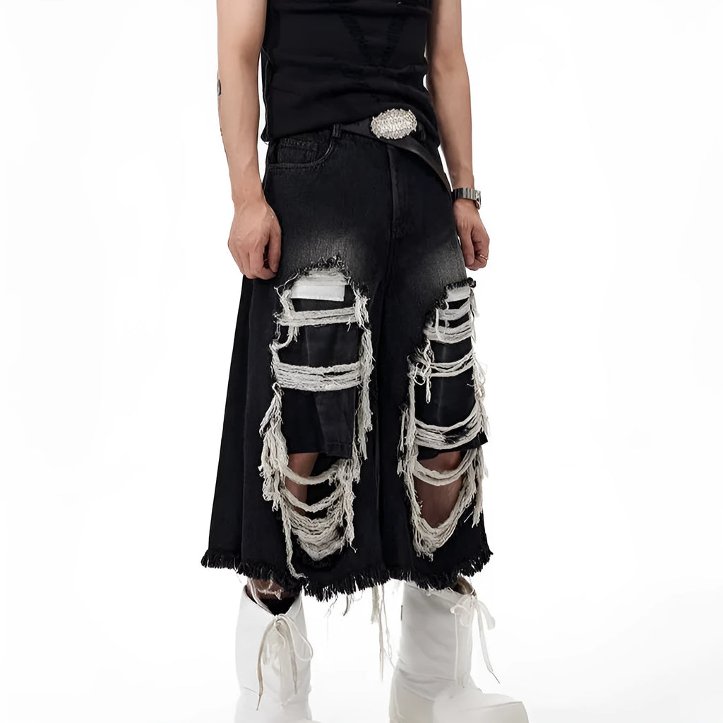 Black wide-leg cropped jeans with ripped patch detailing and mid-high waist