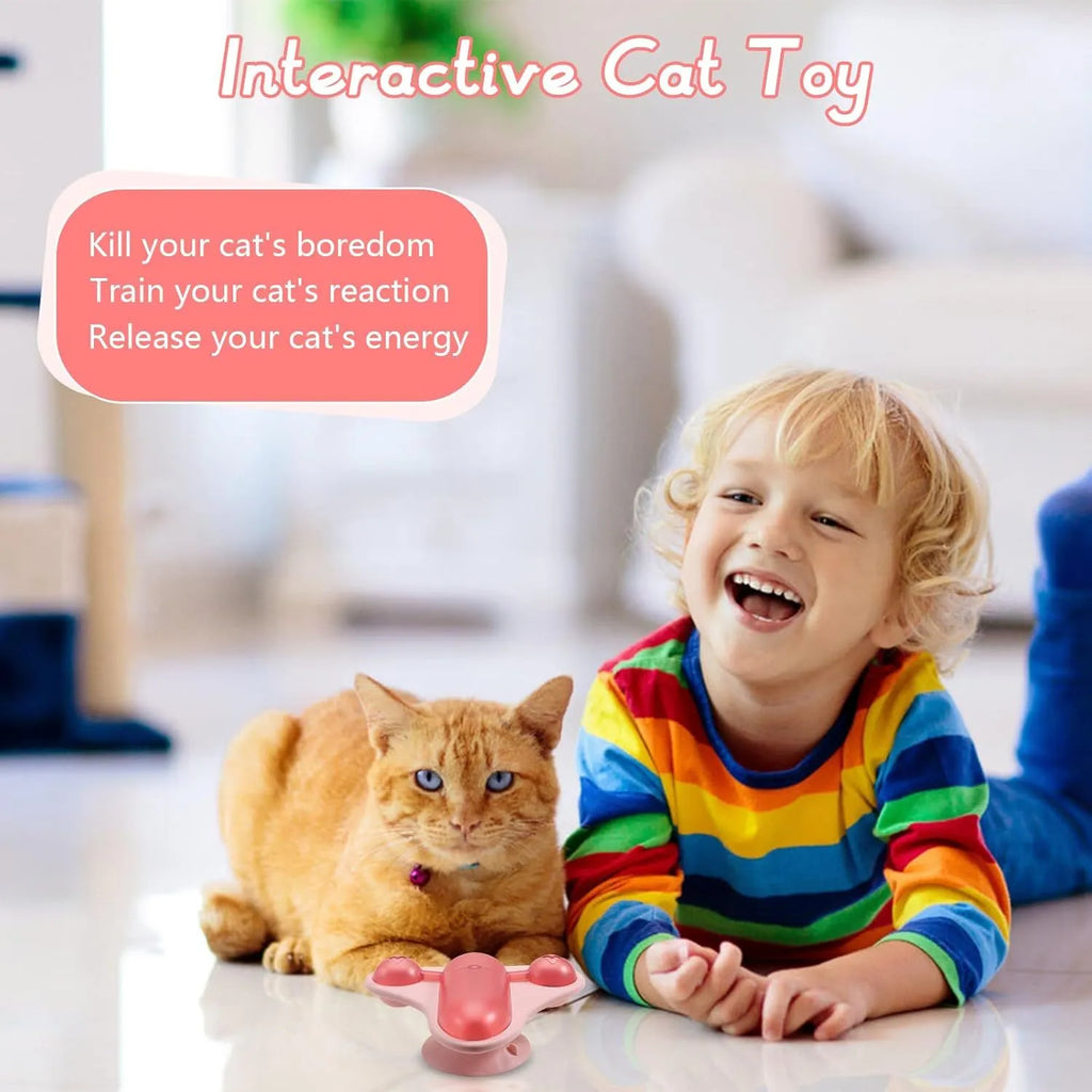 Blue interactive pet puzzle feeder toy with bell, catnip, and snack cabin on a suction cup base.
