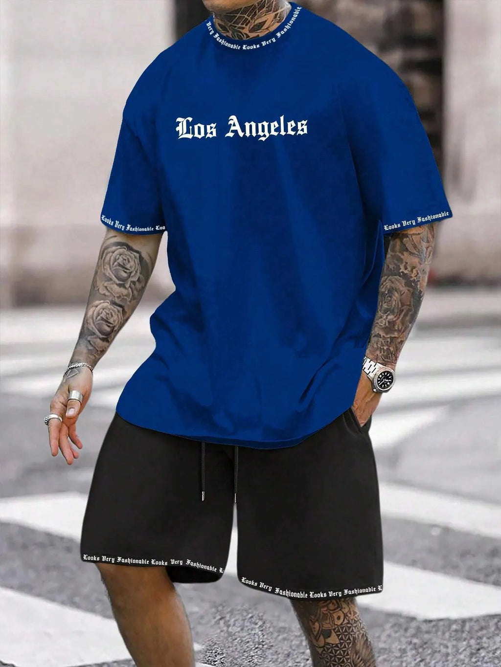 Men's navy blue printed short-sleeved top and matching shorts sports set on a white background
