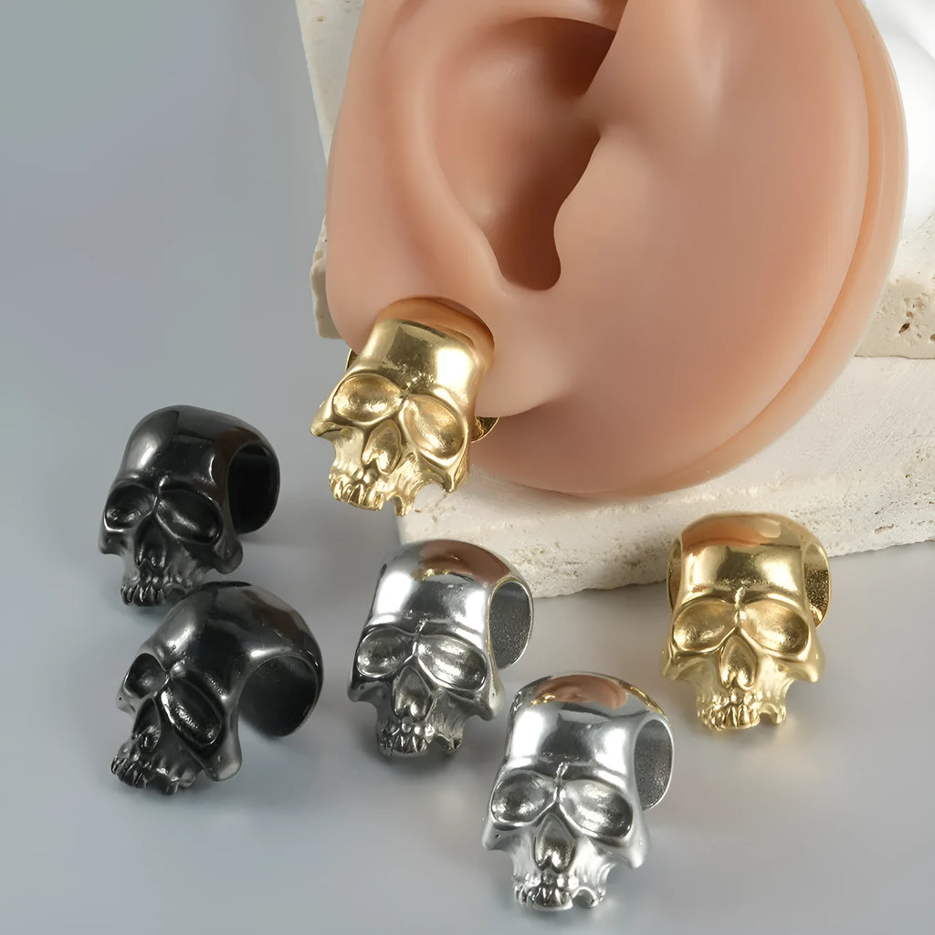 Stainless steel hollow skull Buddha earrings showing four electroplated colour options