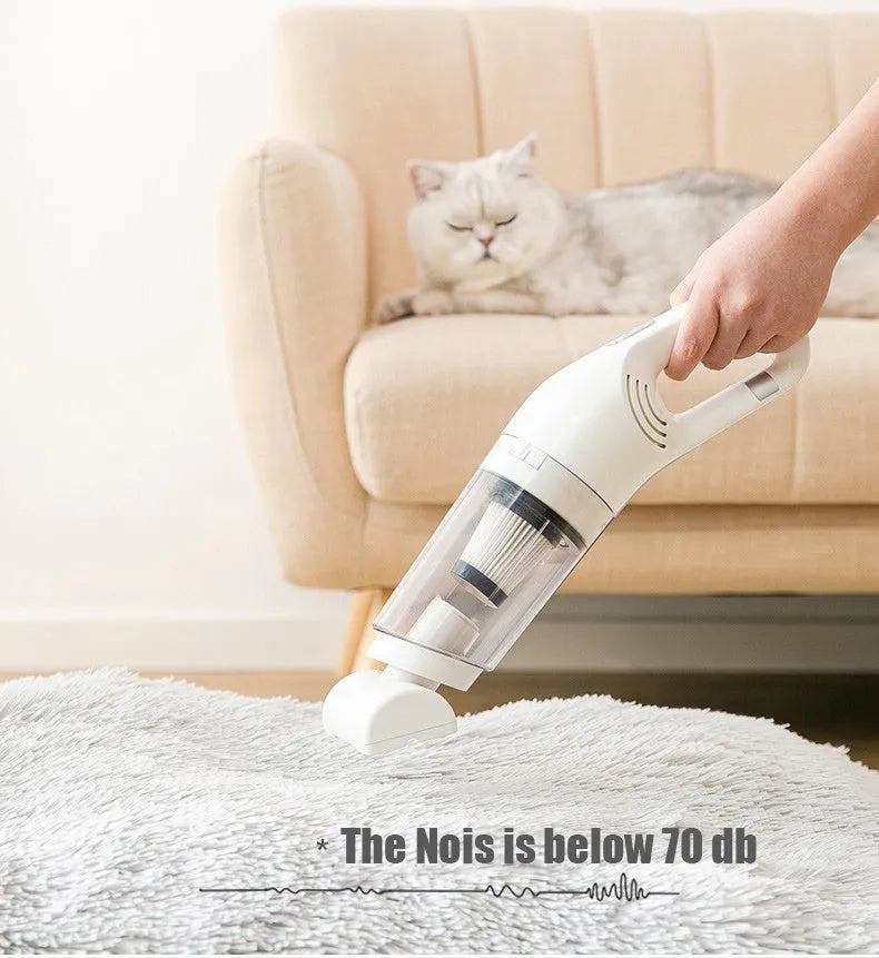Cordless electric pet hair absorber with 28000Pa suction, white colour, shown on a sofa