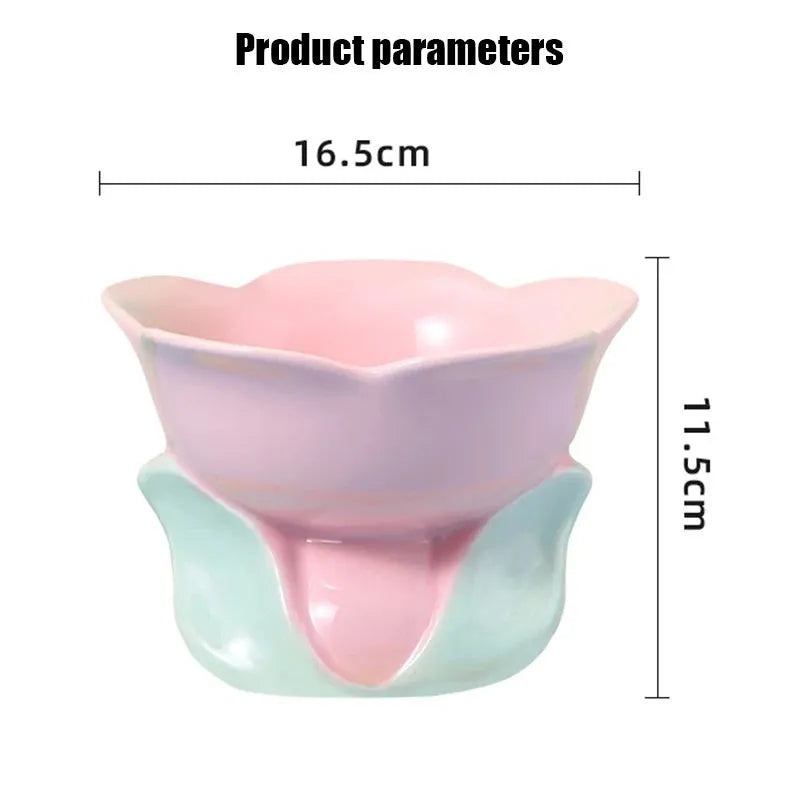 Blue ceramic pet bowl with floral pattern, raised on a non-slip base for cat or small dog feeding.