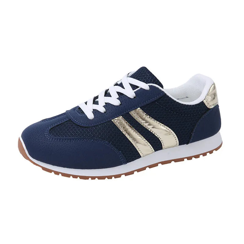 Blue women's casual tennis shoes with cross straps and white rubber sole