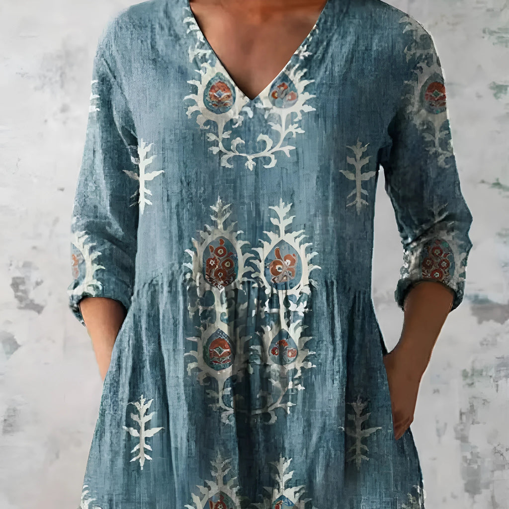 Women's printed loose dress with 3/4 sleeves and a wave skirt, shown in a variety of pattern styles.