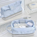 Polyester folding double-layer pencil case in dark blue, blue, and cream white colours.